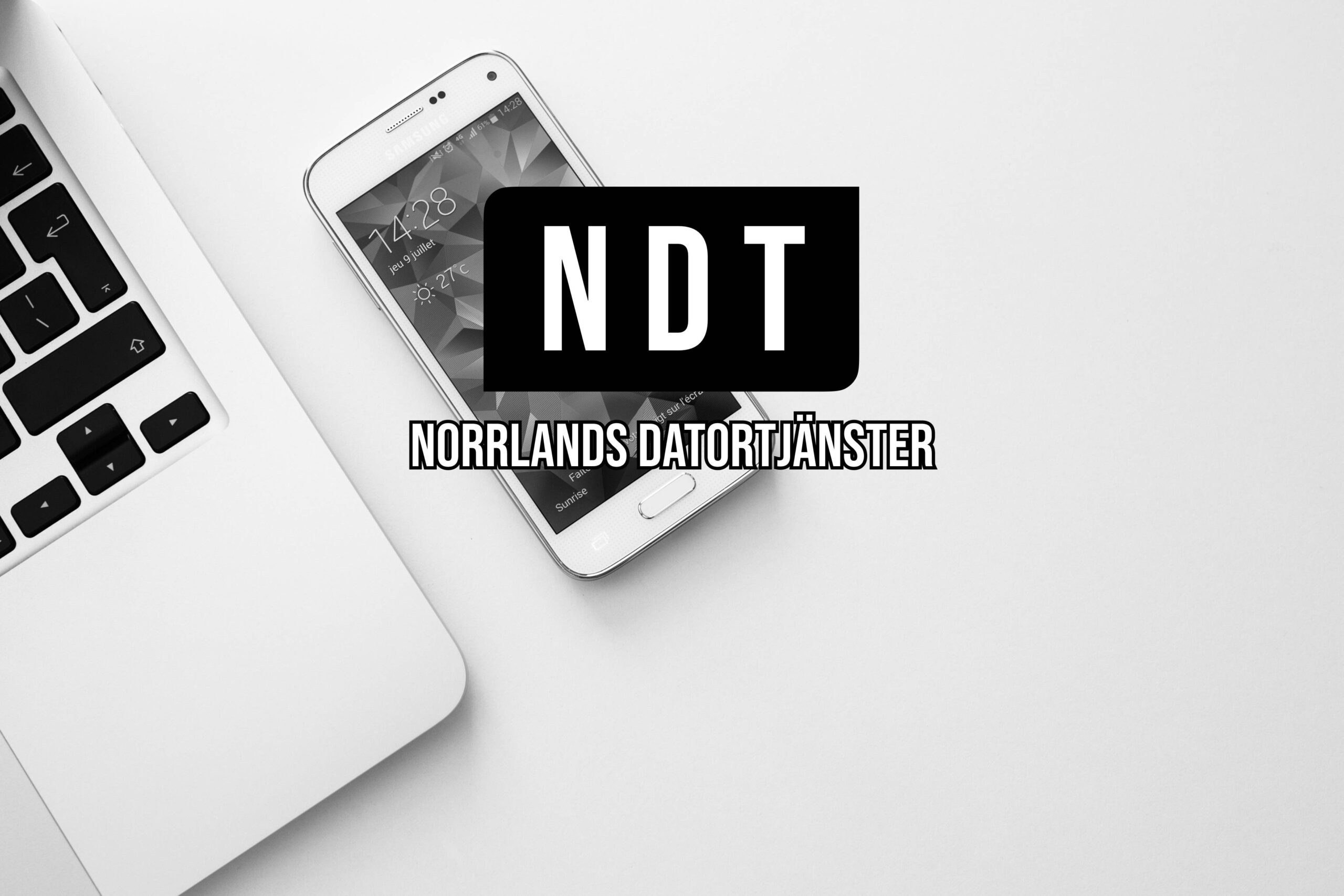 White picture with a laptop, smartphone and the Norrlands Datortjänster Logo and Text